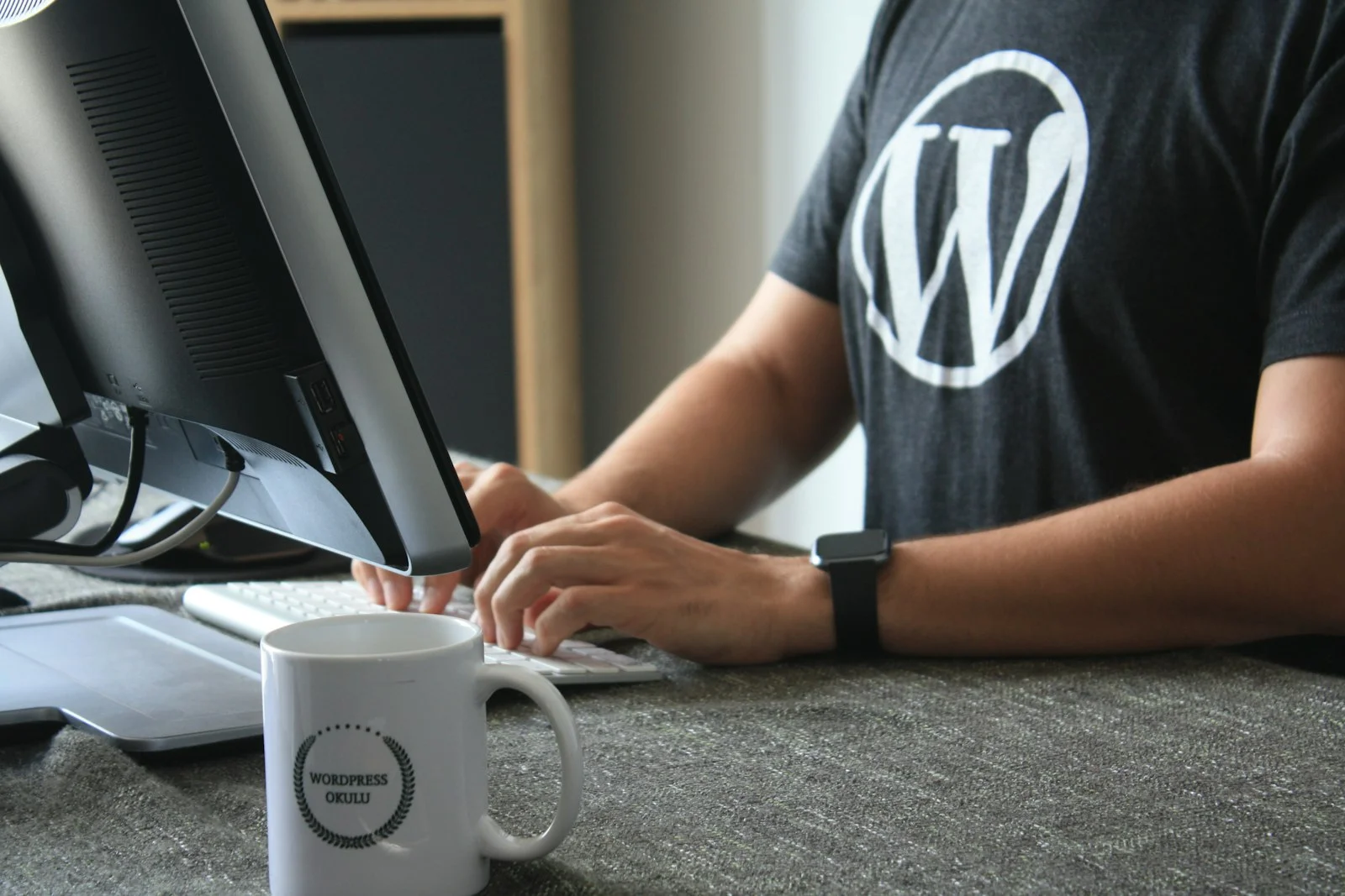 person in black and white t-shirt using computer person in black and white t-shirt using computer